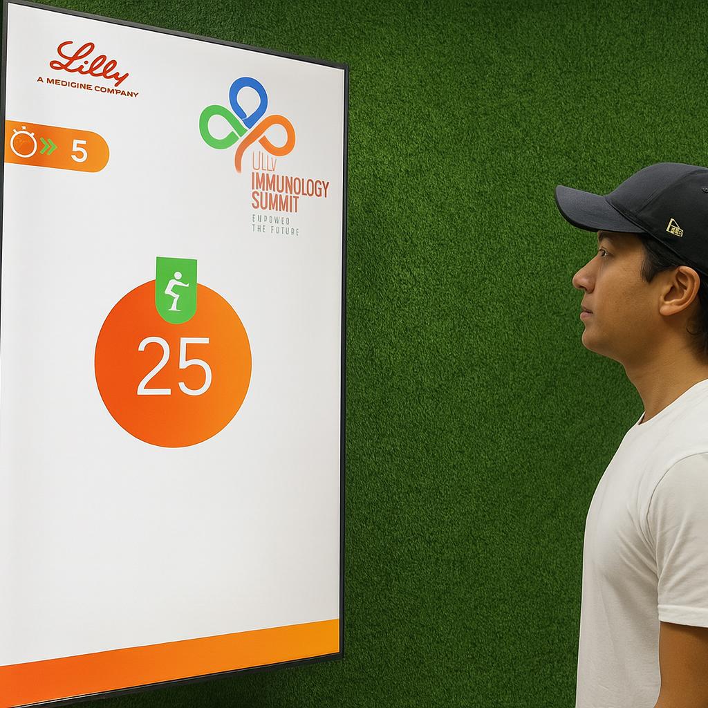 Participants enjoying the Squat Game Challenge at a corporate event in Dubai, engaging in fitness and team-building through real-time interactive squat tracking.